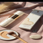 Cosmetic product with packaging on a soft pink fabric background